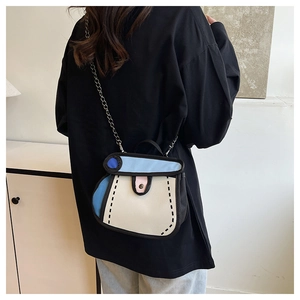 Model wearing a 2D cartoon style canvas handbag with bold outlines and a metal chain