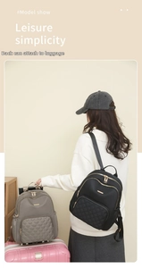 Detail showing the trolley sleeve on the back of a quilted nylon backpack for easy travel