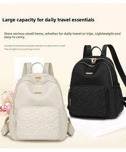 Detail of waterproof nylon backpack showing black and cream quilted diamond patterns