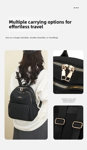 Detail view of black nylon backpack with gold zippers and diamond quilted pocket details