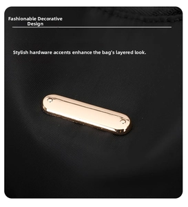 Detail view of oval light gold hardware plate on black nylon fabric backpack material