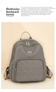 Close-up of grey waterproof nylon backpack featuring quilted front pocket and silver zipper