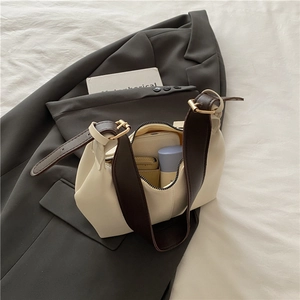 Chic cream white faux leather shoulder bag with wide coffee strap and interior storage view