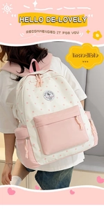Detail of floral student backpack featuring pink stars and brand logo on cream fabric