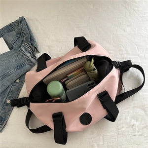 Pink nylon travel duffel bag with large capacity storage for fitness and short trips
