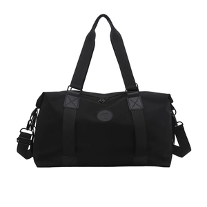 Minimalist black nylon large capacity travel bag with double handles and shoulder strap