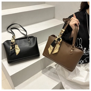 Close-up of tote bags with premium stitching and chain print silk scarf decoration