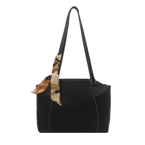 Retro black tote bag with white stitching and floral scarf on minimalist white background
