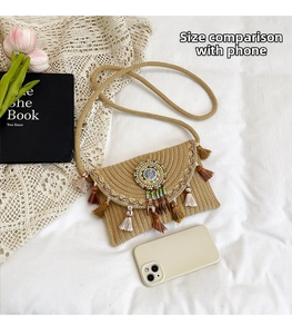Detail of bohemian hand-woven bag with fringe tassels and colorful beaded mandala patterns