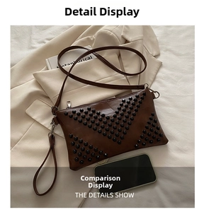 Detail view of brown rivet envelope clutch with silver hardware and dual straps