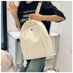 Lightweight nylon backpack side view showing side pocket and sleek minimalist design
