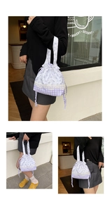 Detail of floral and plaid patchwork shoulder bag with lace trim and drawstring closure