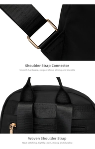 Close-up of durable golden hardware and reinforced nylon stitching on the black backpack