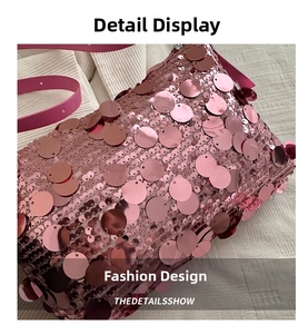 Close-up of pink sequin shoulder bag with metallic mirror finish and leather strap