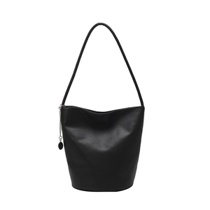 Minimalist black pebbled leather bucket bag with silver chain detail for women