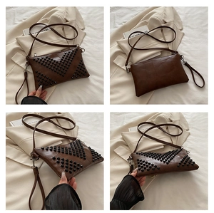 Detailed views of a vintage dark brown rivet handbag with a studded V-pattern design