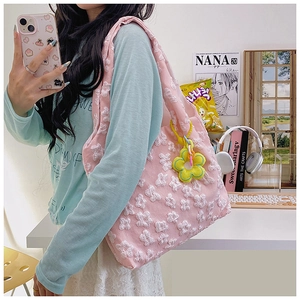 Pink floral lace tote bag with detailed embroidery and yellow sunflower charm