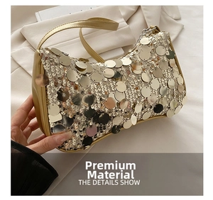 Detailed macro view of sparkling champagne gold sequins and metallic textures on the bag