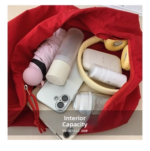 Top view of spacious red canvas tote bag showing organized interior storage capacity