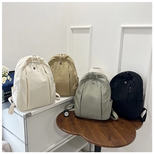 Lightweight nylon backpacks in cream, khaki, green, and black for daily commute