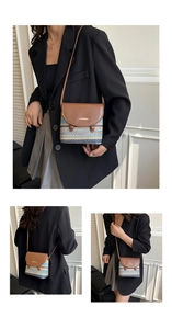 Détail du sac à bandoulière tissé avec rabat en cuir marron et logo doré de Jingpin
