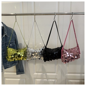 Detail of four colorful Y2K sequin shoulder bags in green, silver, black, and pink