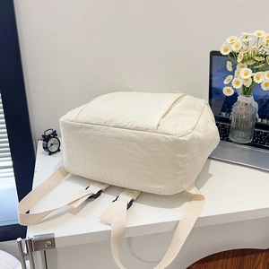 Minimalist off-white lightweight nylon backpack for commuting and travel usage