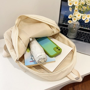 Lightweight off-white nylon backpack with large capacity and multiple compartments for commuting