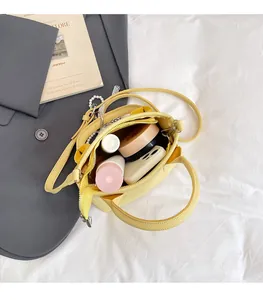 Yellow pebble leather bucket bag interior showing large capacity for essentials
