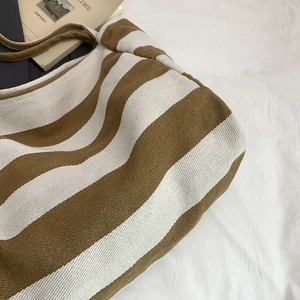 Large striped canvas tote bag with brown and white patterns for casual summer shopping