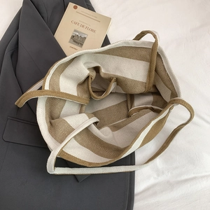 Large striped canvas tote bag in brown and cream with spacious interior and inner pocket