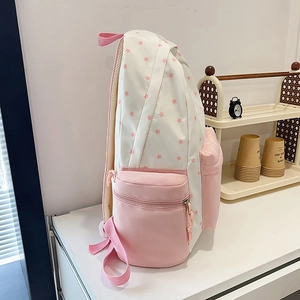 Pink floral star pattern student backpack with side pocket and water-resistant nylon fabric