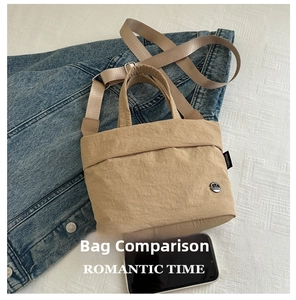 Khaki nylon crossbody bag shown next to a smartphone for size comparison.