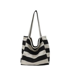 Large black and white striped canvas tote bag with long shoulder straps for daily use