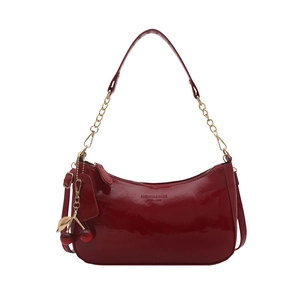 Glossy red patent leather shoulder bag with gold chain strap and cherry charm detail