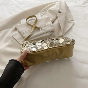 Chic gold sequin baguette bag with leather strap and silver chain for women
