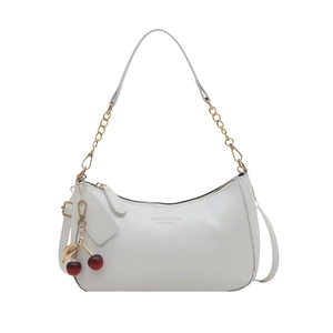 Glossy white patent leather crescent shoulder bag with cherry charm and gold chain