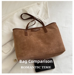 Macro shot of brown suede tote bag featuring leather handles and brand logo patch