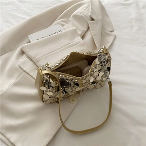 Golden sequin baguette bag for women showing spacious interior for phone and cosmetics