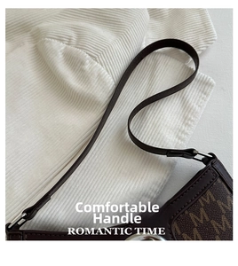 Detailed close-up of dark brown shoulder bag with vintage M-letter monogram print