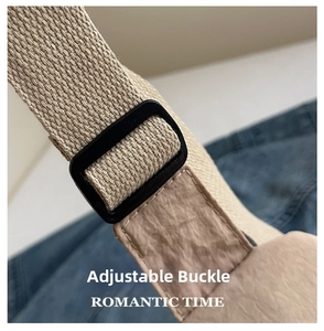 Close-up of adjustable strap buckle on a khaki canvas crossbody bag for outdoor use