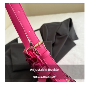 Close-up of adjustable strap with gold buckle on pink sequin shoulder bag