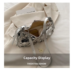 Detailed interior view of silver sequin shoulder bag showing spacious storage capacity