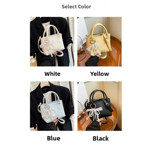 Selection of chic square bucket bags with pearl bow charms in white, yellow, blue, and black