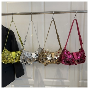 Detail of sequined crescent shoulder bags in green, silver, gold, and magenta colors