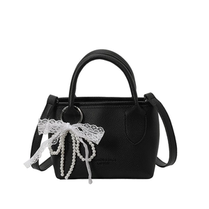 Chic black lychee grain bucket bag with pearl and lace bow charm accessories