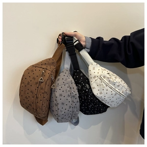 Corduroy waist bags in four colors featuring heart and bow patterns with adjustable straps