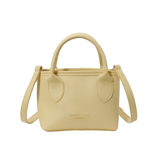 Chic cream yellow litchi texture leather bucket bag with top handle and crossbody strap