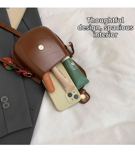 Interior view showing the spacious storage capacity of this retro brown saddle bag