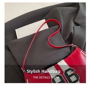 Close-up of retro racing style Boston bag with red and white leather and number 96 patch